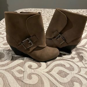 Woman’s taupe wedge booties